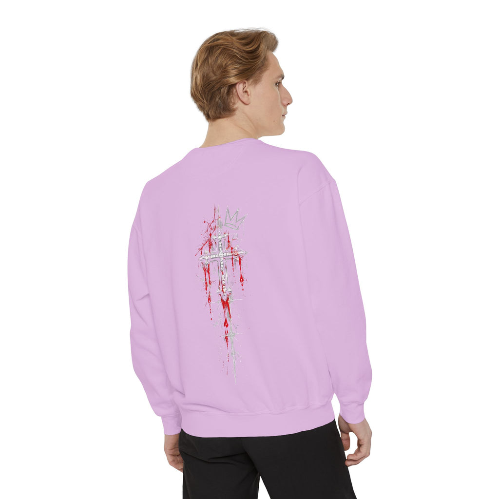 Back of lavender sweatshirt featuring a silver jeweled cross with red blood splatters and a crown motif.